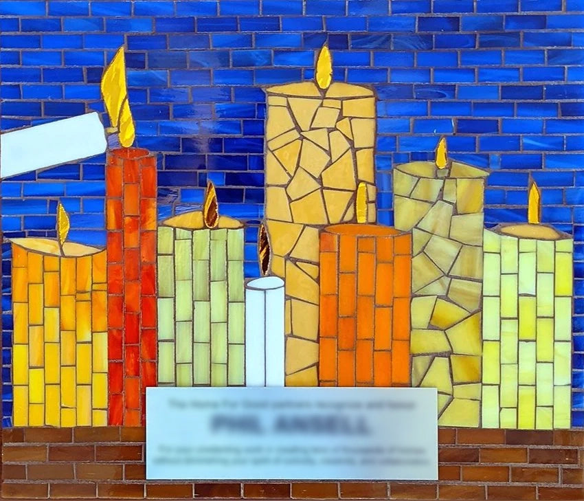 Mosaic award of candles being lit