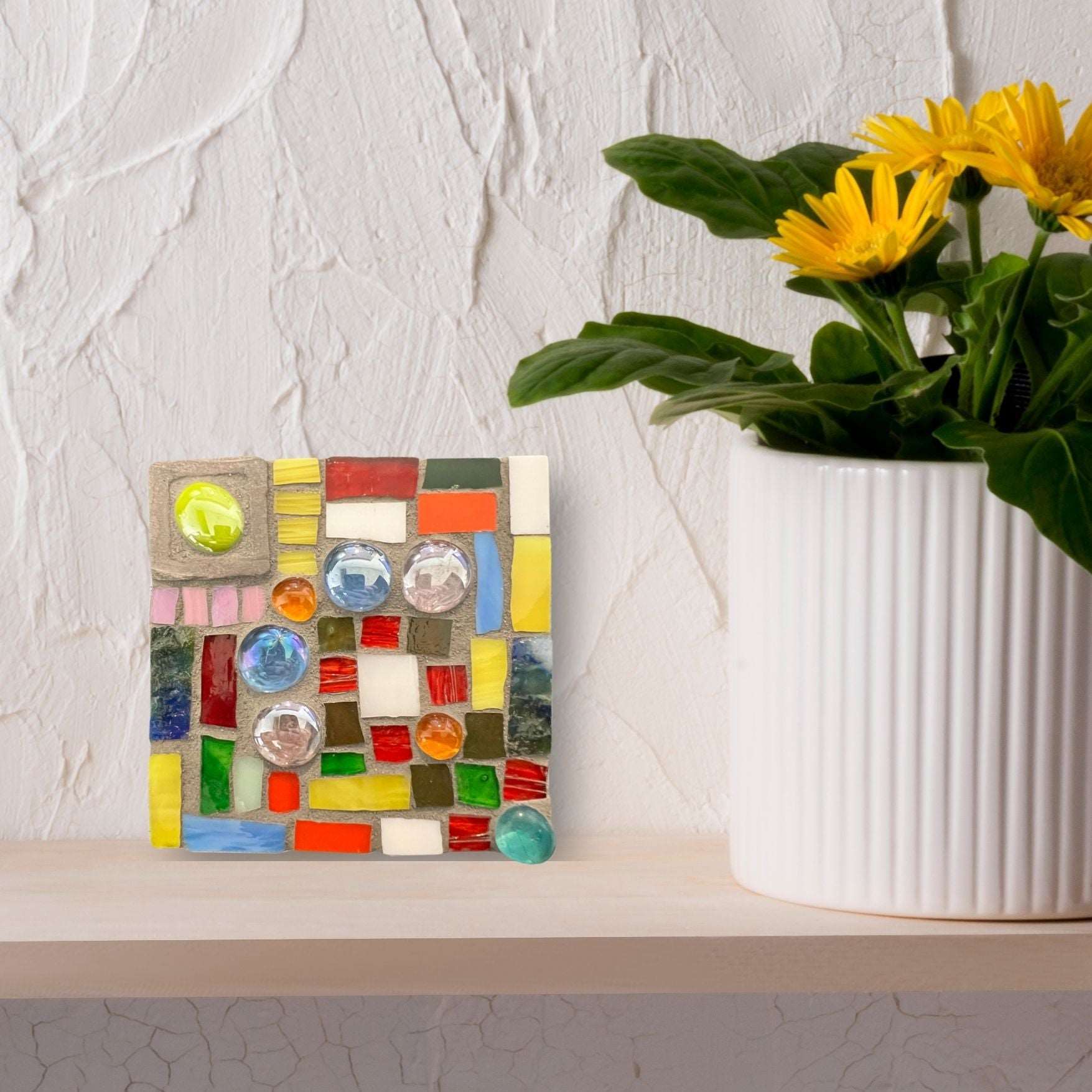 Bright and sunny colored rectangles, squares and circles nestled together to create this mosaic tile.
