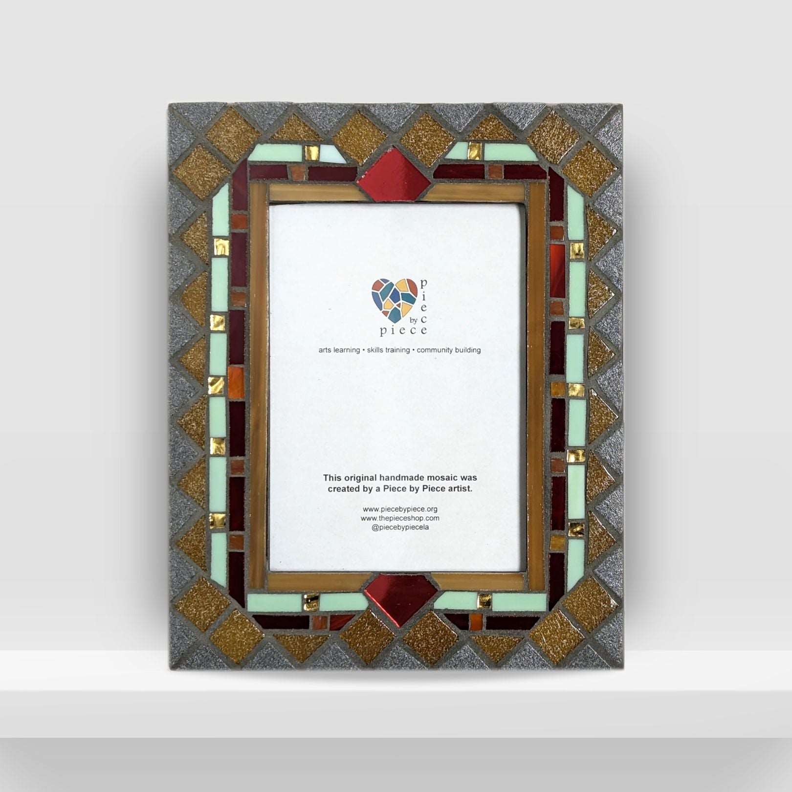Jewel-toned mosaic frame with gold details.